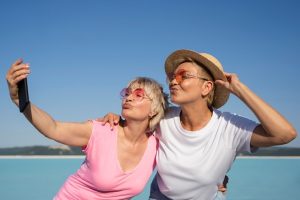 medium-shot-women-taking-selfie